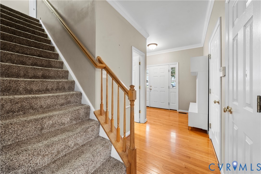 1301 Hawkins Wood Circle Midlothian, VA 23114 - Photo 17 of 50 a view of an entryway with wooden floor