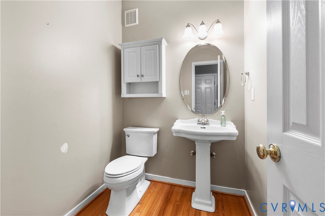 1301 Hawkins Wood Circle Midlothian, VA 23114 - Photo 19 of 50 a bathroom with a sink and a mirror