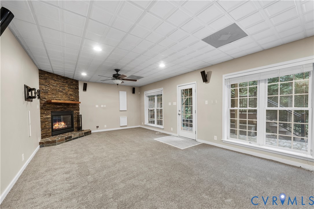 1301 Hawkins Wood Circle Midlothian, VA 23114 - Photo 20 of 50 a view of an empty room with a fireplace and a window