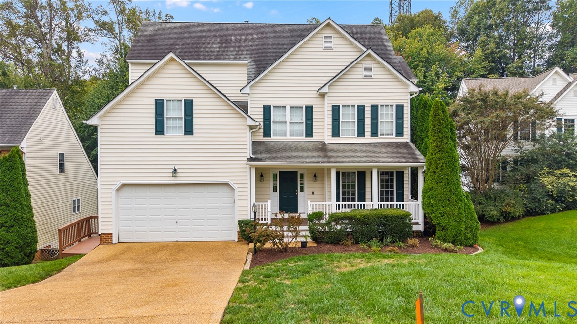 1301 Hawkins Wood Circle Midlothian, VA 23114 - Photo 2 of 50 a front view of a house with a yard and garage