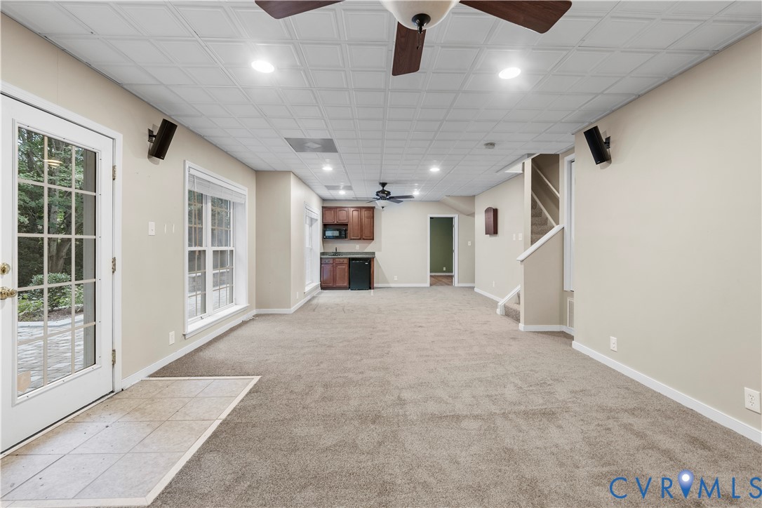 1301 Hawkins Wood Circle Midlothian, VA 23114 - Photo 22 of 50 a view of an empty room with a window and kitchen view
