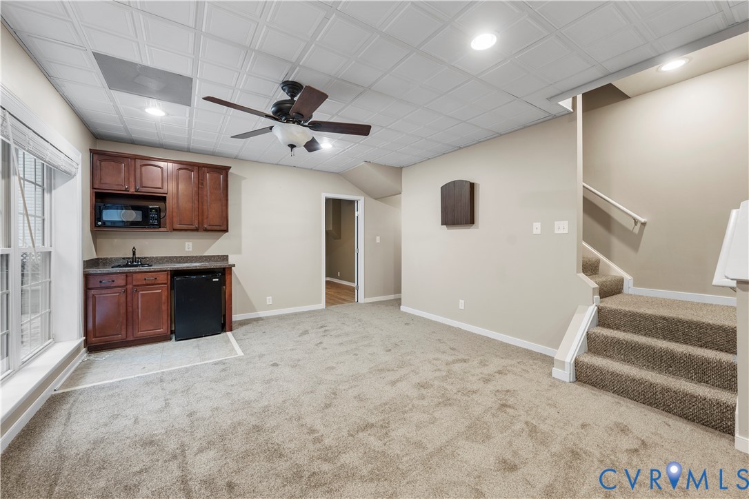 1301 Hawkins Wood Circle Midlothian, VA 23114 - Photo 23 of 50 a kitchen with stainless steel appliances granite countertop a stove and a sink with granite countertops