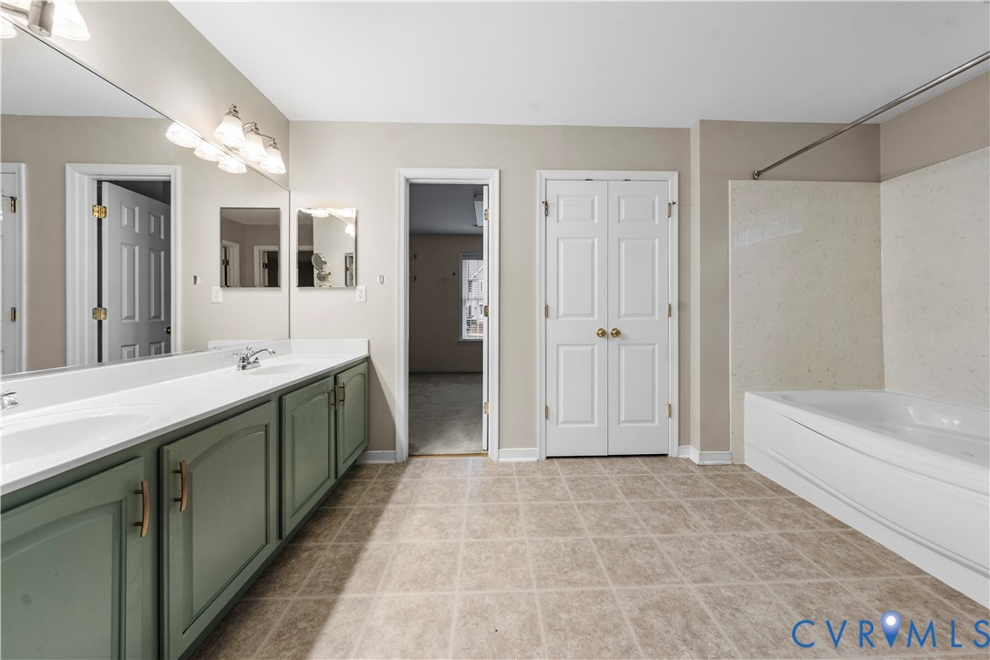 1301 Hawkins Wood Circle Midlothian, VA 23114 - Photo 29 of 50 a spacious bathroom with a tub shower and sink