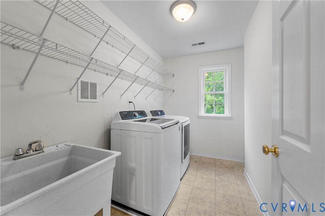 1301 Hawkins Wood Circle Midlothian, VA 23114 - Photo 32 of 50 a utility room with dryer and washer