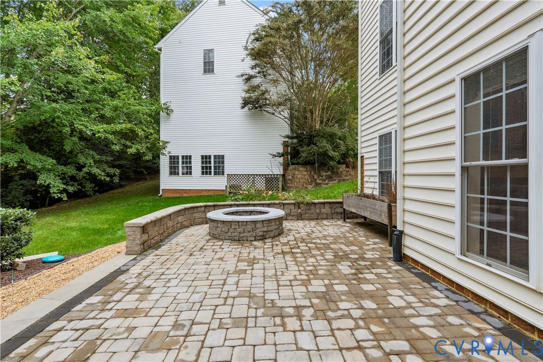1301 Hawkins Wood Circle Midlothian, VA 23114 - Photo 44 of 50 a view of a yard with chairs and a table and chair