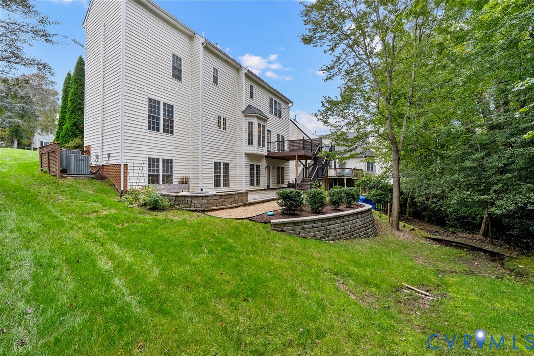 1301 Hawkins Wood Circle Midlothian, VA 23114 - Photo 47 of 50 a view of a house with backyard and sitting area