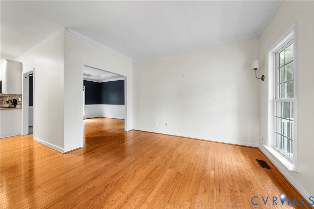 1301 Hawkins Wood Circle Midlothian, VA 23114 - Photo 7 of 50 a view of a room with wooden floor