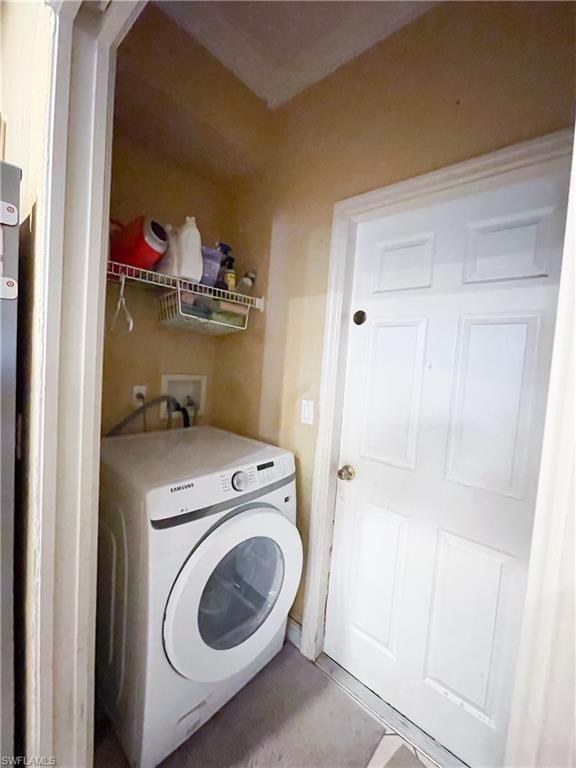 8386 Bamboo Road Fort Myers, FL 33967 - Photo 8 of 32 a utility room with dryer and washer