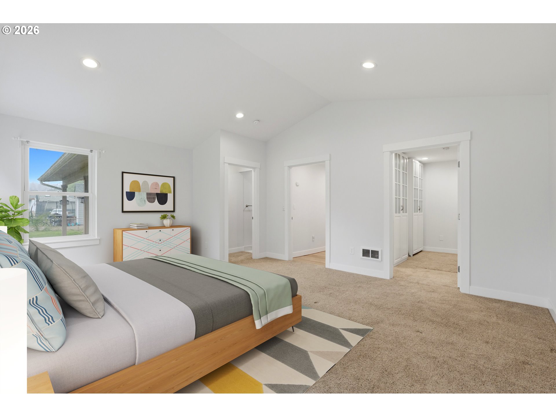 4621 Ohio Street Longview, WA 98632 - Photo 30 of 32 a spacious bedroom with a bed and painting on the wall