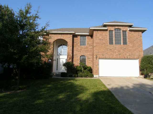 11200 Savin Hill Lane Austin, TX 78739 - Photo 1 of 1 a front view of a house with a yard