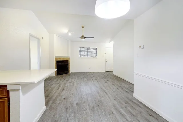a kitchen with stainless steel appliances a refrigerator and a stove top oven