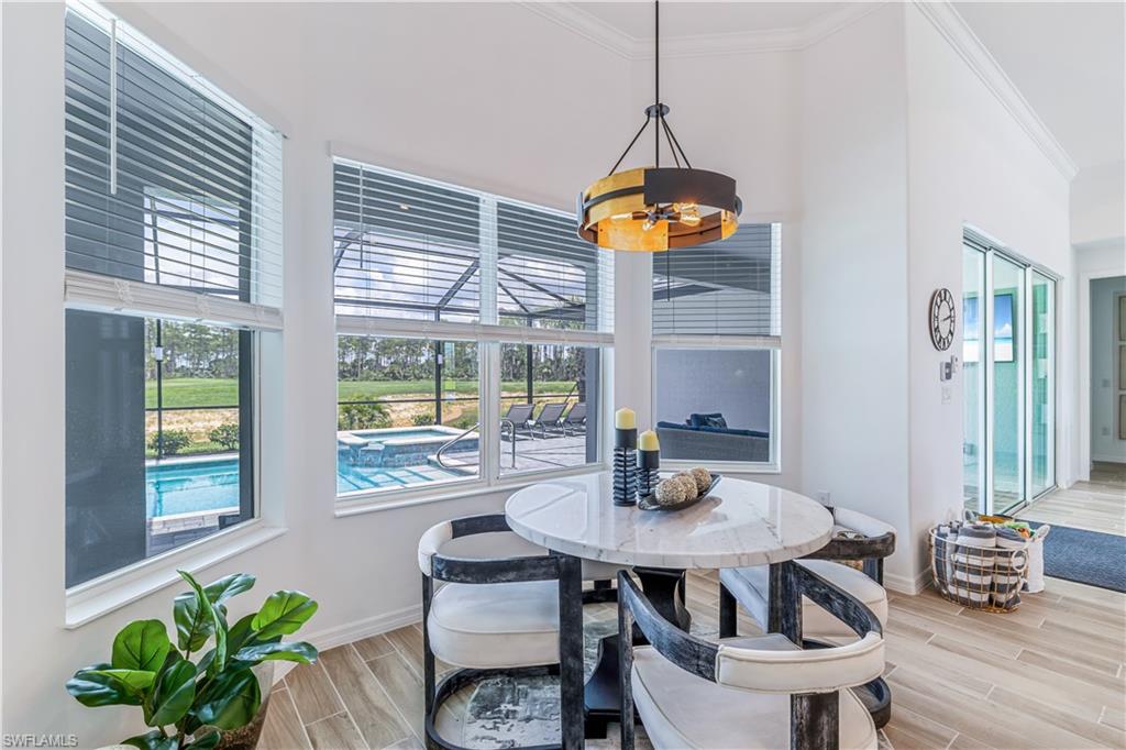 15977 Cranes Marsh Court Babcock Ranch, FL 33982 - Photo 11 of 24 a view of a dining room with furniture window and outside view