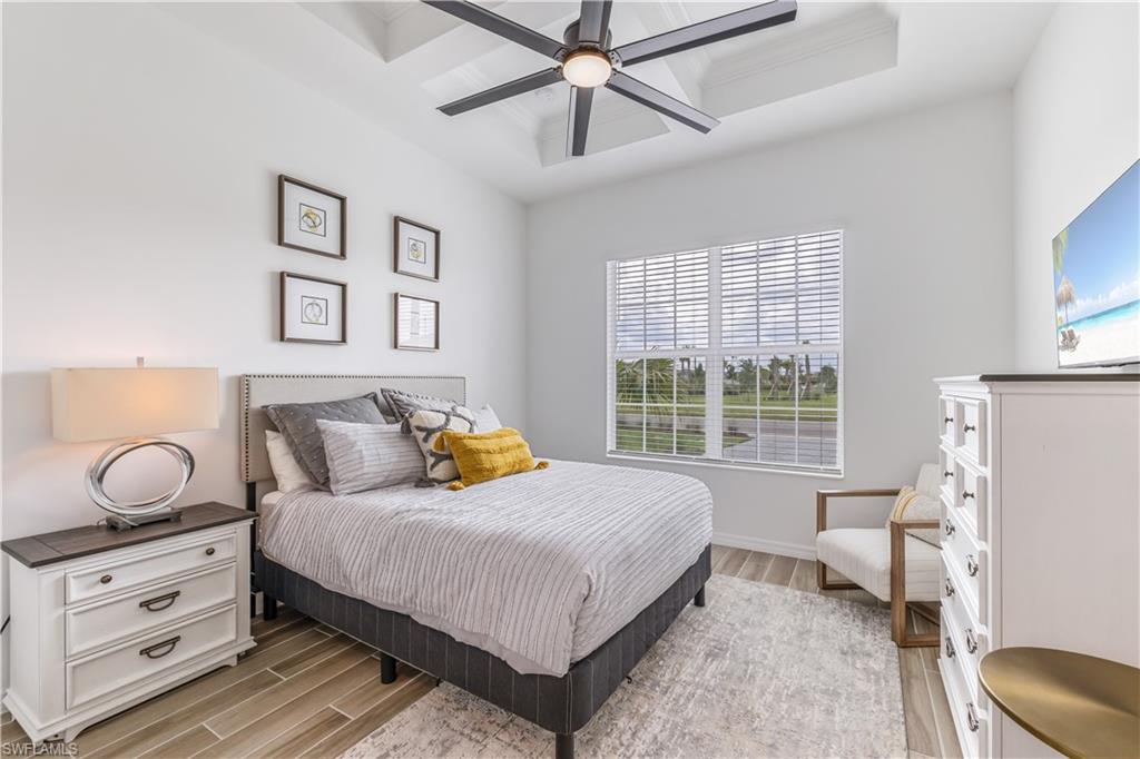 15977 Cranes Marsh Court Babcock Ranch, FL 33982 - Photo 15 of 24 a bedroom with a bed and window