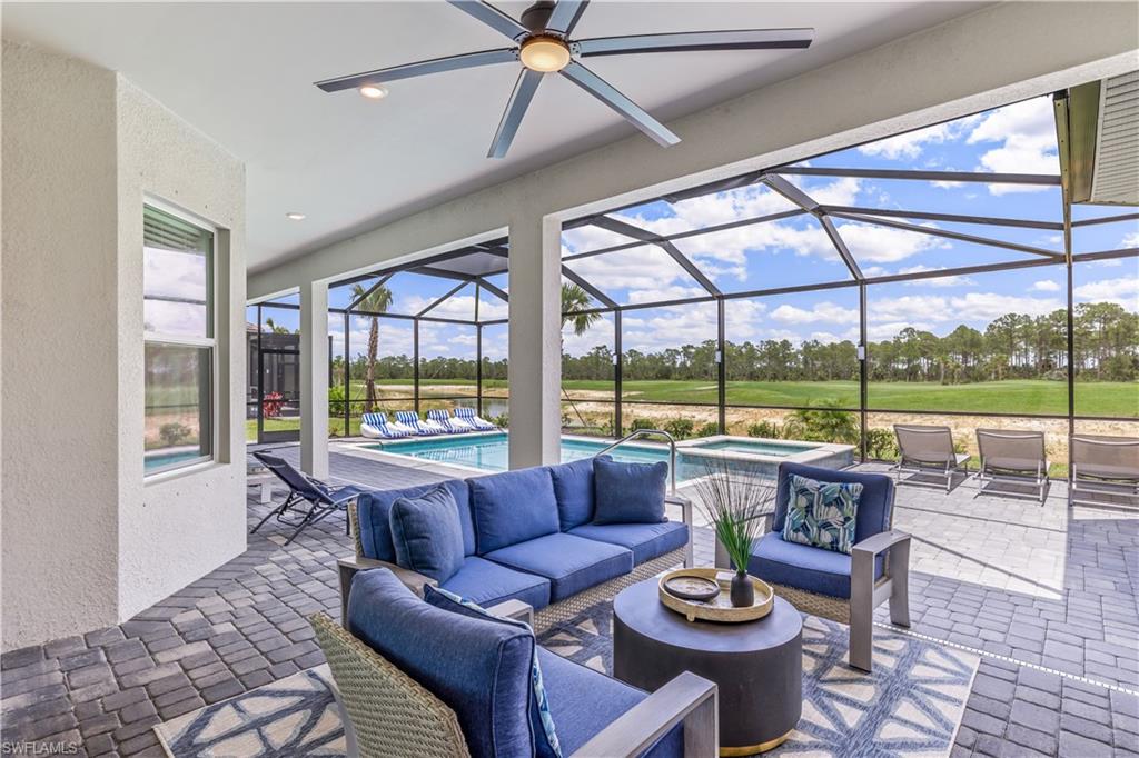 15977 Cranes Marsh Court Babcock Ranch, FL 33982 - Photo 21 of 24 a living room with furniture and a large window with garden view