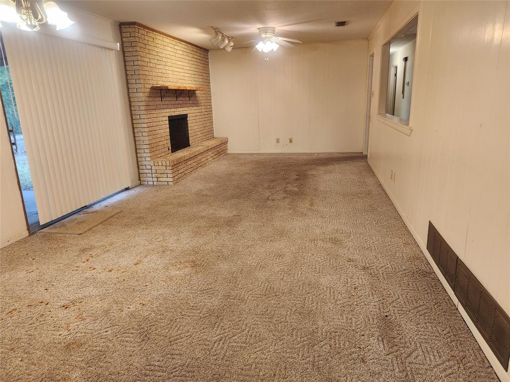 2821 Mccarley Drive Commerce, TX 75428 - Photo 13 of 32 a view of a hallway with an empty room