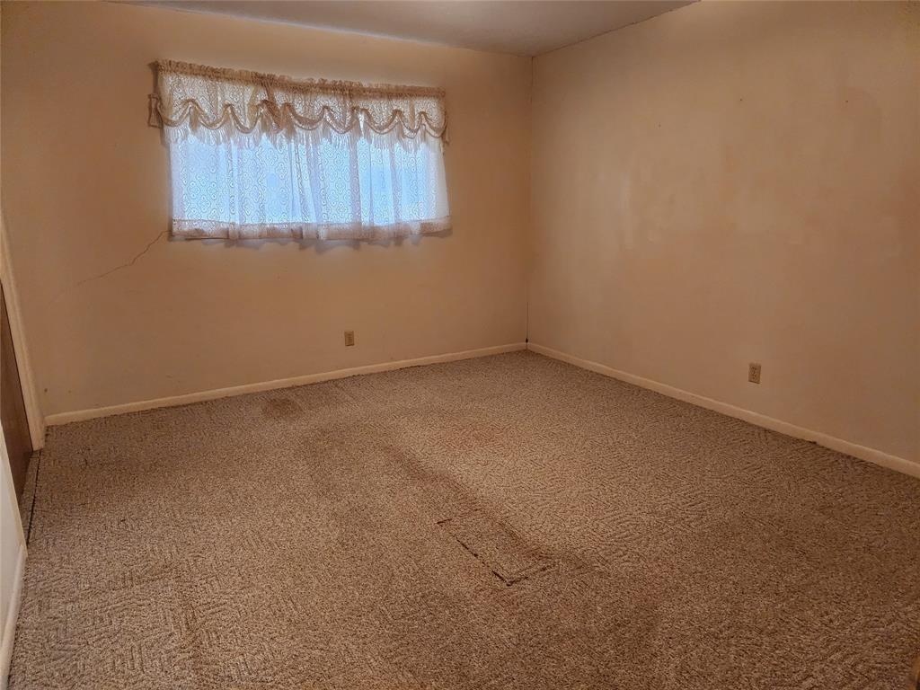 2821 Mccarley Drive Commerce, TX 75428 - Photo 20 of 32 a view of an empty room with a window