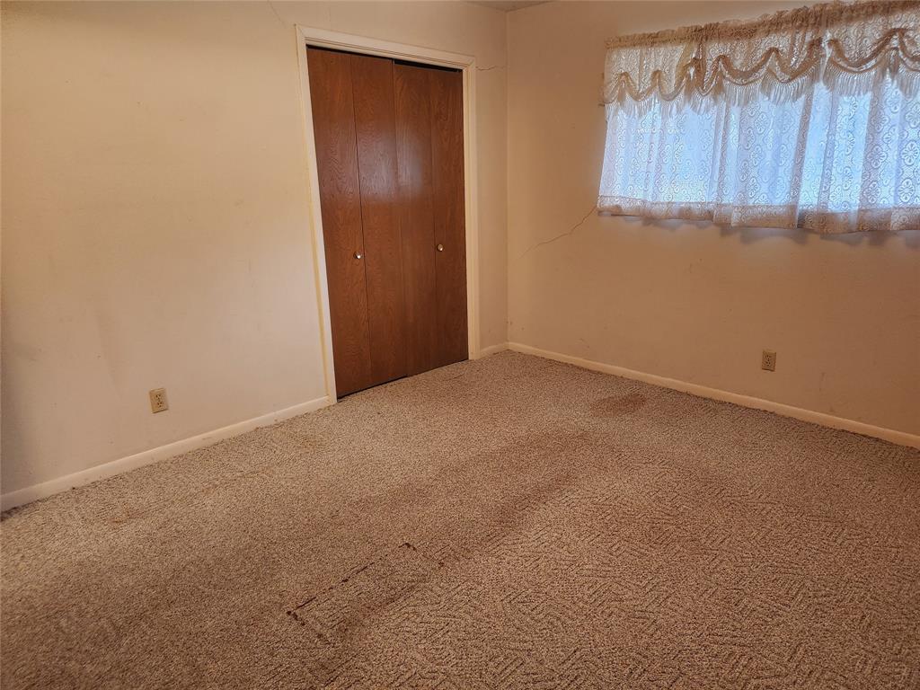 2821 Mccarley Drive Commerce, TX 75428 - Photo 21 of 32 a view of an empty room with a window