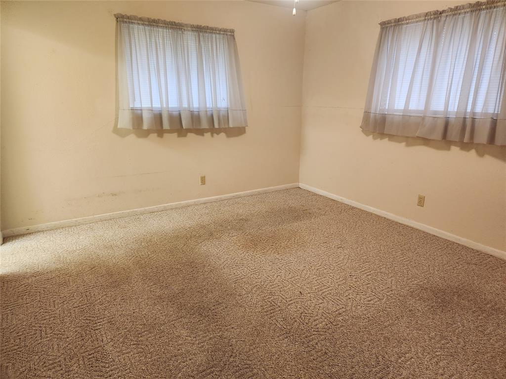 2821 Mccarley Drive Commerce, TX 75428 - Photo 24 of 32 an empty room with a window