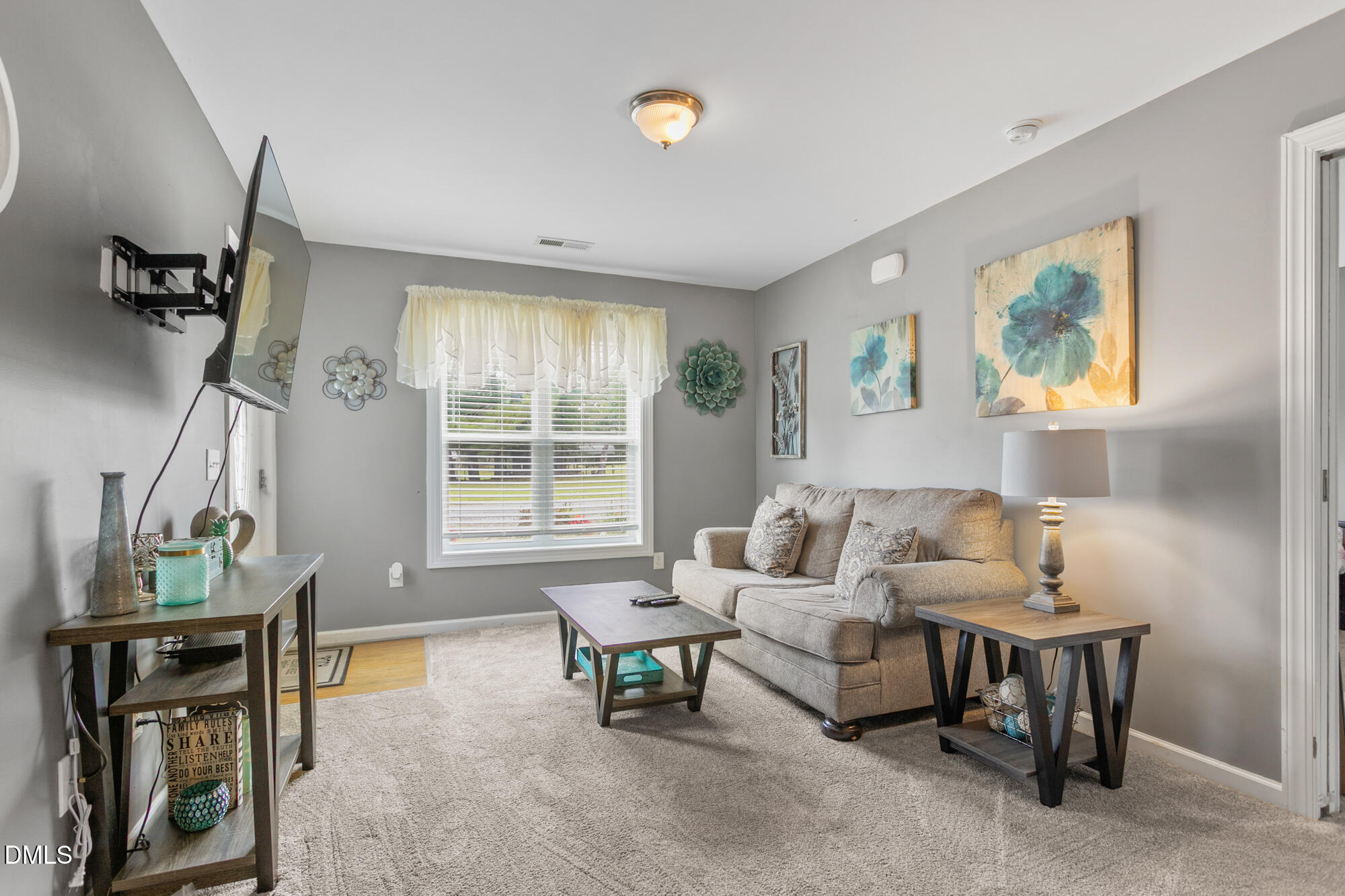 3163 Saul Loop Road Elon, NC 27244 - Photo 24 of 44 a living room with furniture and a window