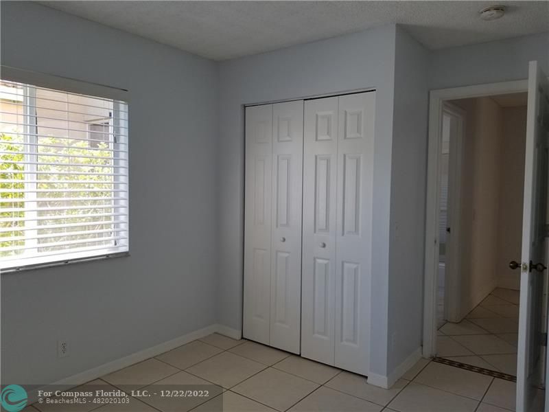 1527 Palermo Drive Weston, FL 33327 - Photo 11 of 15 a view of an empty room with a window
