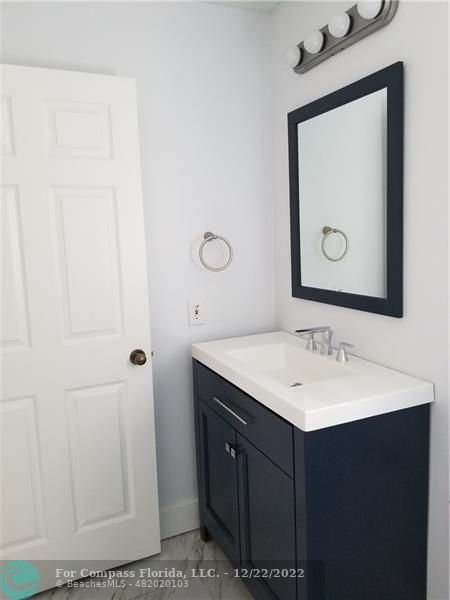 1527 Palermo Drive Weston, FL 33327 - Photo 12 of 15 a bathroom with a sink vanity and a mirror