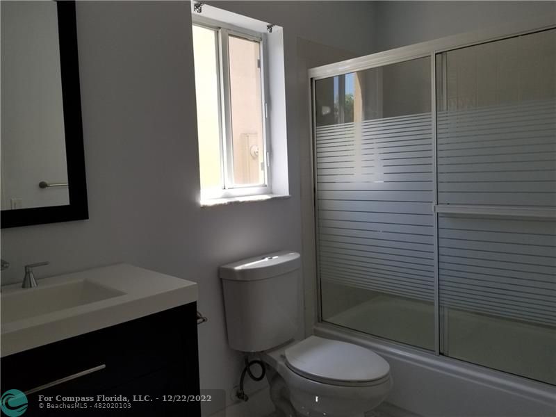 1527 Palermo Drive Weston, FL 33327 - Photo 13 of 15 a bathroom with a toilet a sink and shower