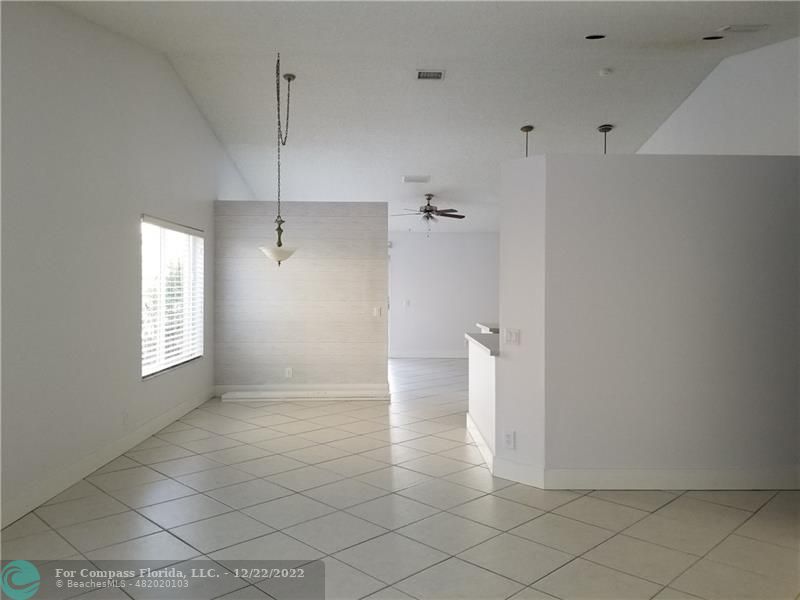1527 Palermo Drive Weston, FL 33327 - Photo 2 of 15 a view of an empty room with a window