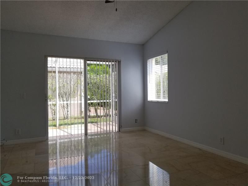 1527 Palermo Drive Weston, FL 33327 - Photo 6 of 15 a view of an empty room and window