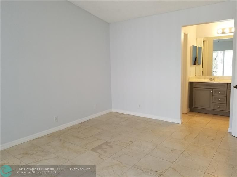 1527 Palermo Drive Weston, FL 33327 - Photo 7 of 15 a view of an empty room with cabinet and mirror