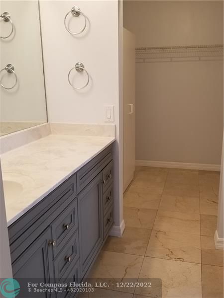 1527 Palermo Drive Weston, FL 33327 - Photo 9 of 15 a bathroom with a granite countertop sink and a mirror