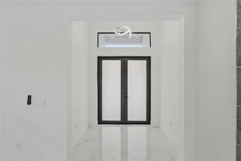 a white cabinet with a mirror