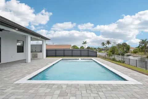 a view of swimming pool with a chair