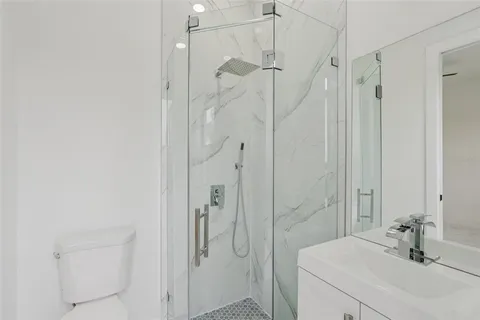 a bathroom with a shower and a sink