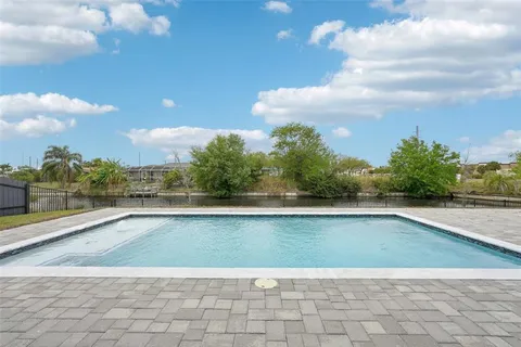 a view of swimming pool with a yard