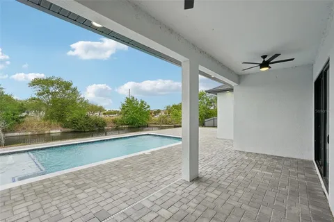 a view of swimming pool with seating space
