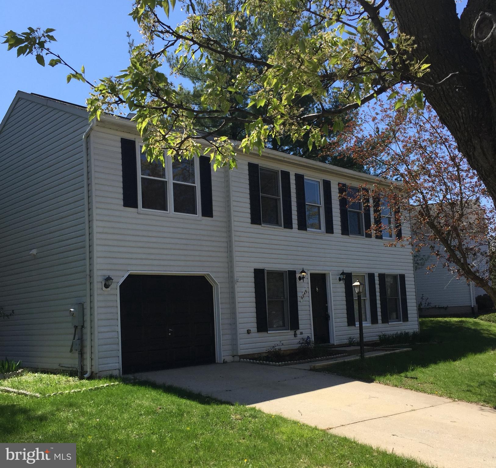 6249 Light Point Place Columbia, MD 21045 - Photo 1 of 18 a front view of a house with a garden