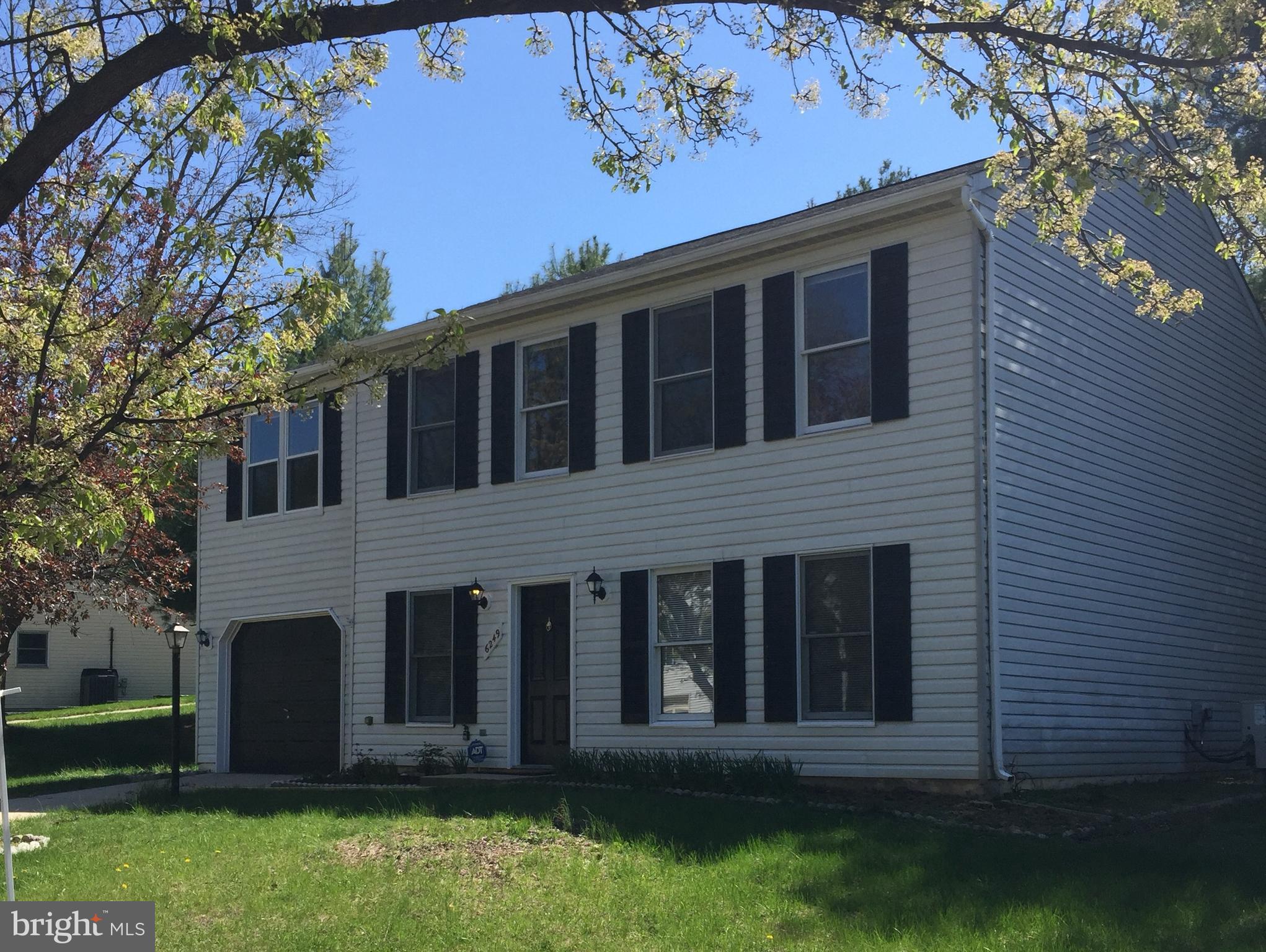 6249 Light Point Place Columbia, MD 21045 - Photo 2 of 18 a front view of a house with a yard