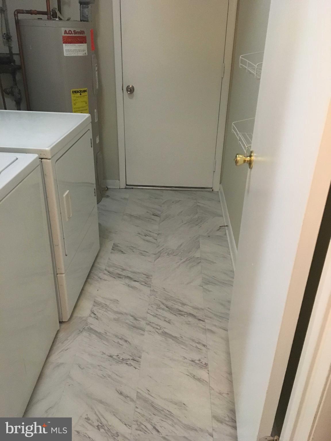 6249 Light Point Place Columbia, MD 21045 - Photo 18 of 18 a utility room with dryer and washer