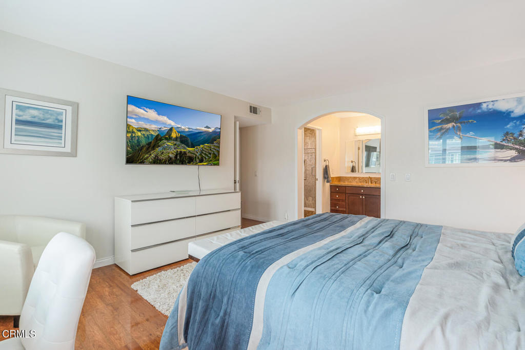 4604 Falkirk Bay Oxnard, CA 93035 - Photo 20 of 40 a bedroom with a bed and a flat screen tv