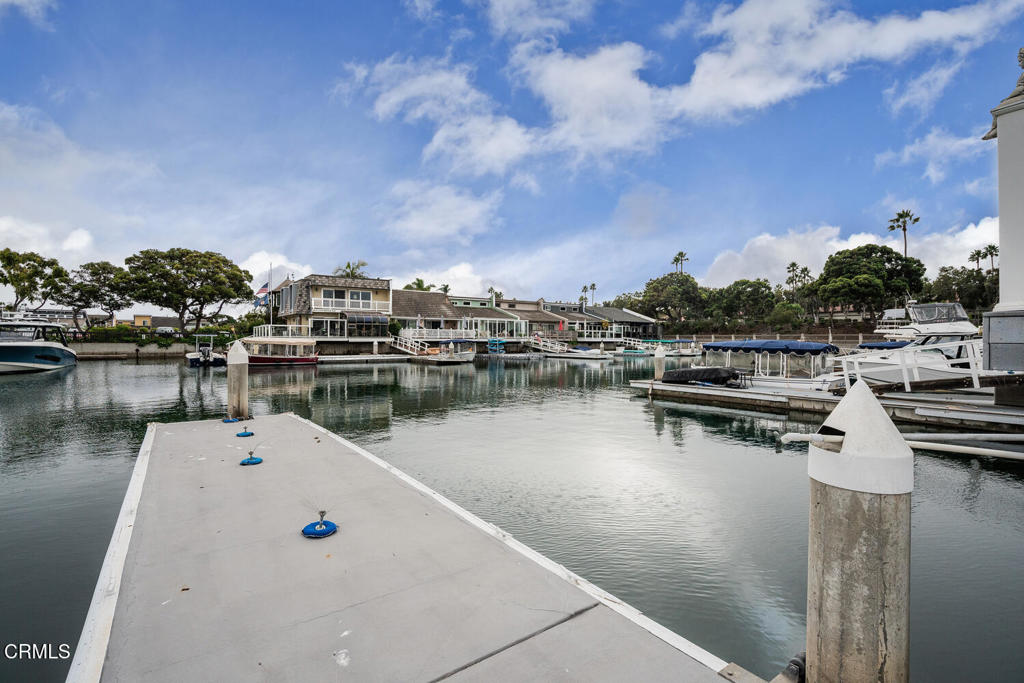 4604 Falkirk Bay Oxnard, CA 93035 - Photo 24 of 40 a view of a lake with houses in the back