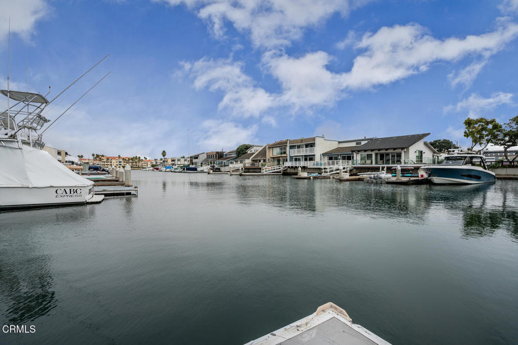 4604 Falkirk Bay Oxnard, CA 93035 - Photo 25 of 40 a view of a lake with houses in the back