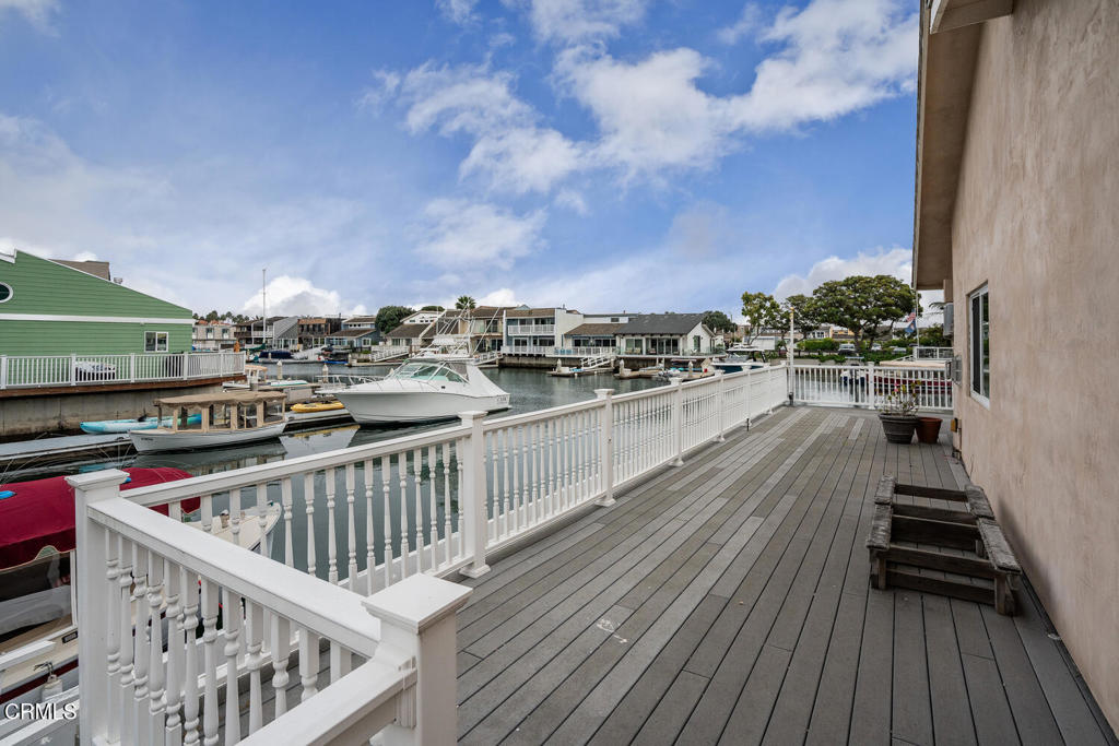 4604 Falkirk Bay Oxnard, CA 93035 - Photo 27 of 40 a balcony with wooden floor and city view