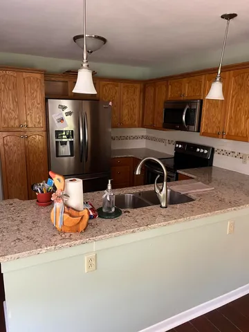 a kitchen with sink and window