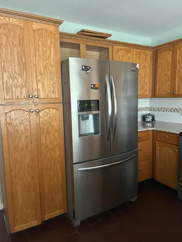 a kitchen with a sink and a microwave