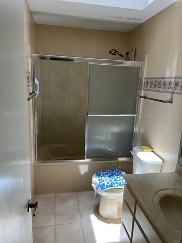 a backyard of a house with yard fire pit and outdoor seating