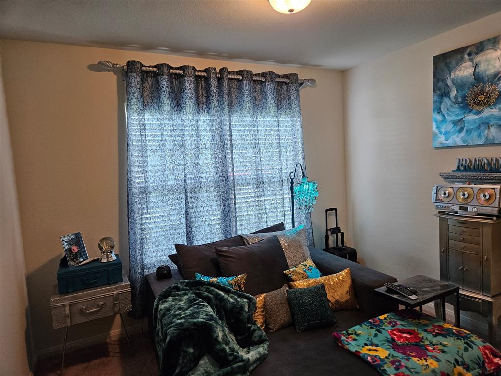 14262 Wrangler Way Dallas, TX 75253 - Photo 17 of 23 a bedroom with furniture and a window