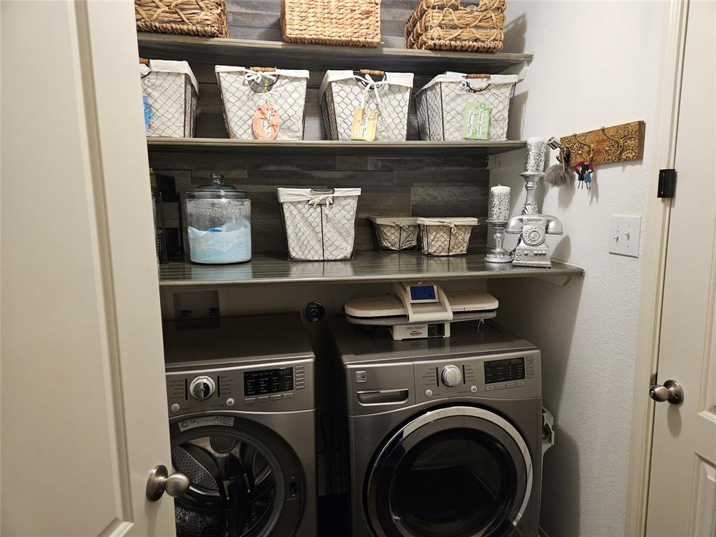 14262 Wrangler Way Dallas, TX 75253 - Photo 20 of 23 a view of washer and dryer in a shelf