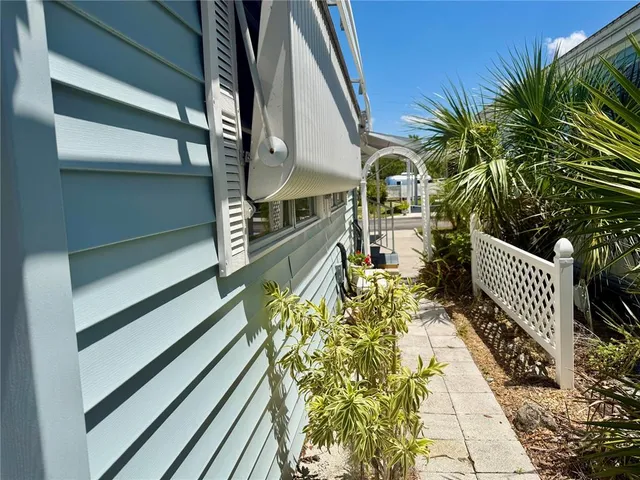 a view of balcony with wooden floor and fence