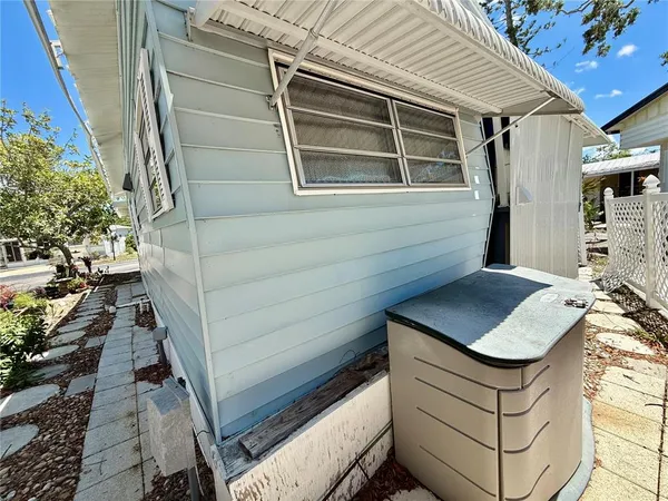 a view of a backyard with sitting area