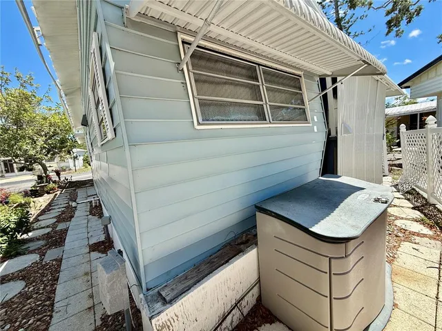 a view of a backyard with sitting area